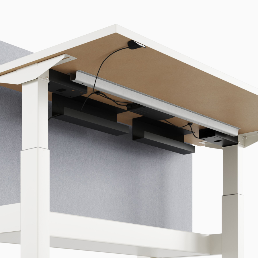 A close-up view of Nevi Link standing desk system's under-surface cable management.
