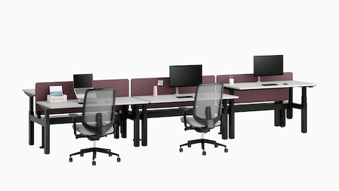 Nevi Link Sit-Stand bench with light grey work surfaces, maroon-coloured fabric screens, CBS work tools and Verus Chairs.