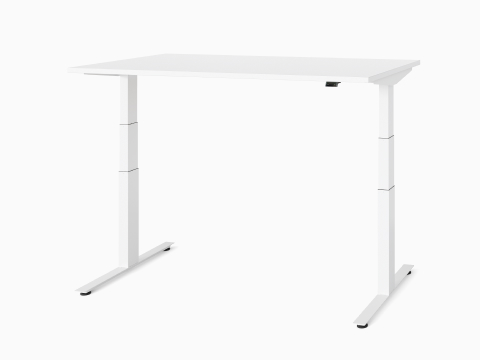 A white Nevi Sit-Stand Desk at standing height, viewed at an angle.