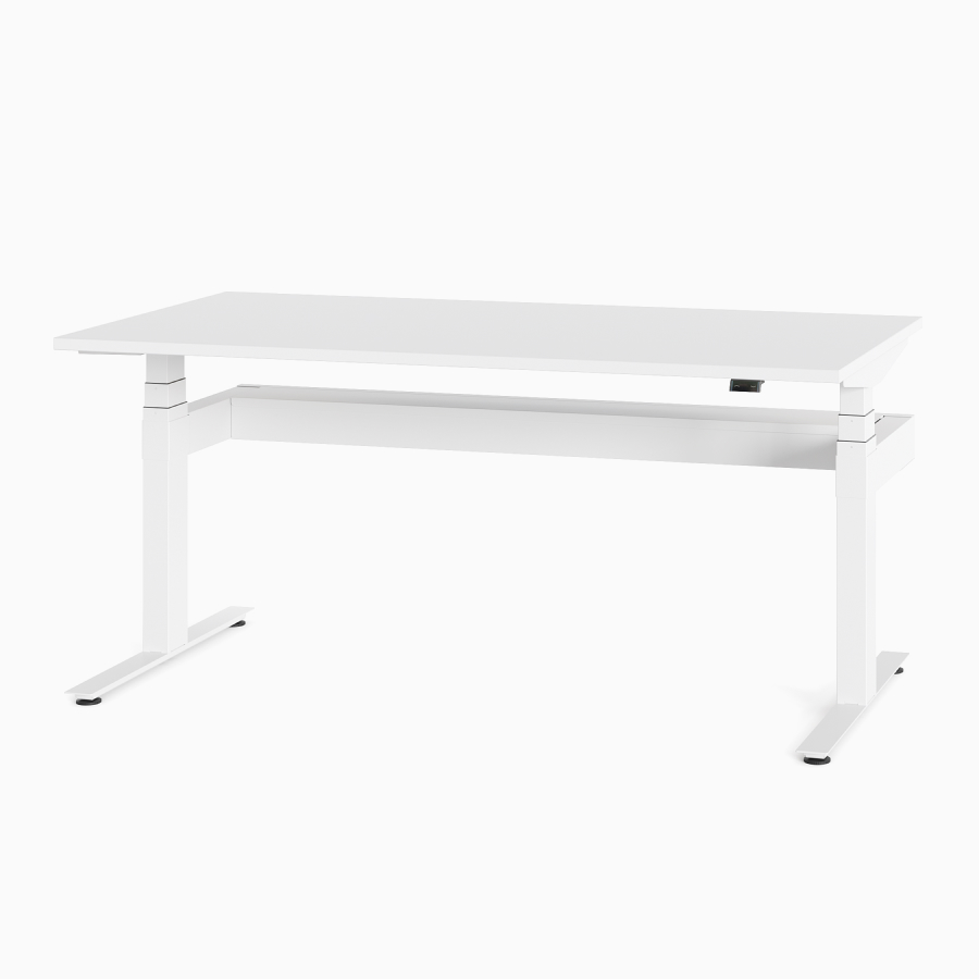 A white Nevi Sit-Stand Desk at seated height, viewed at an angle.