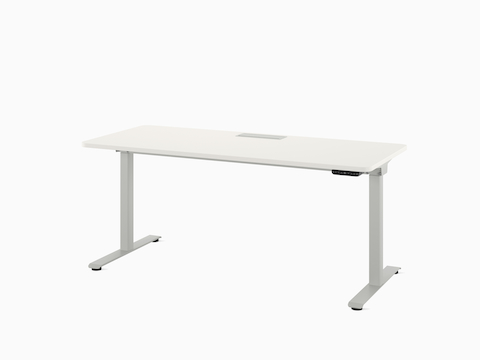 Front view of a freestanding Nevi Sit-to-Stand Desk in white with worksurface lowered.