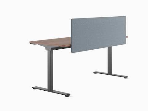 Back view of a freestanding Nevi Sit-to-Stand Desk with dark grey legs, a dark work surface and a grey fabric screen.