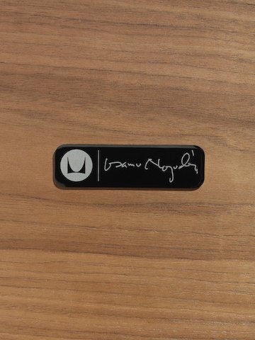 Isamu Noguchi's signature on a medallion that's affixed to every Noguchi Table as a mark of authenticity. 