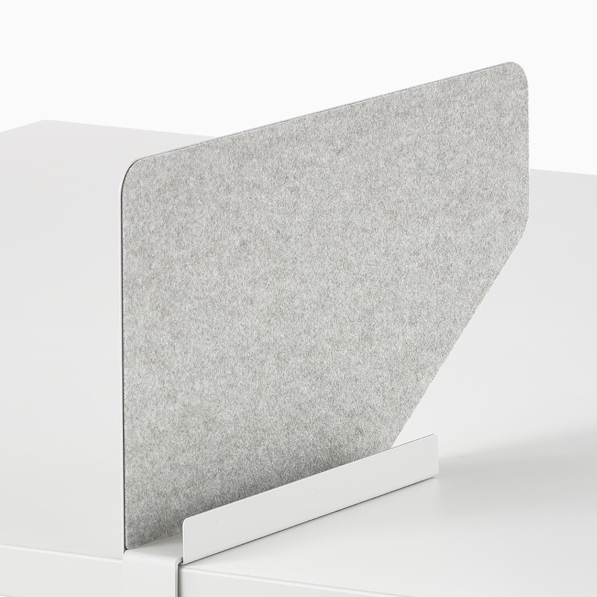 Grey OE1 Boundary Screen with liner on a white OE1 Rectangular Table, viewed from an angle.