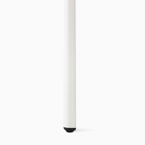 Up close angle of a white OE1 Table leg with black glide.