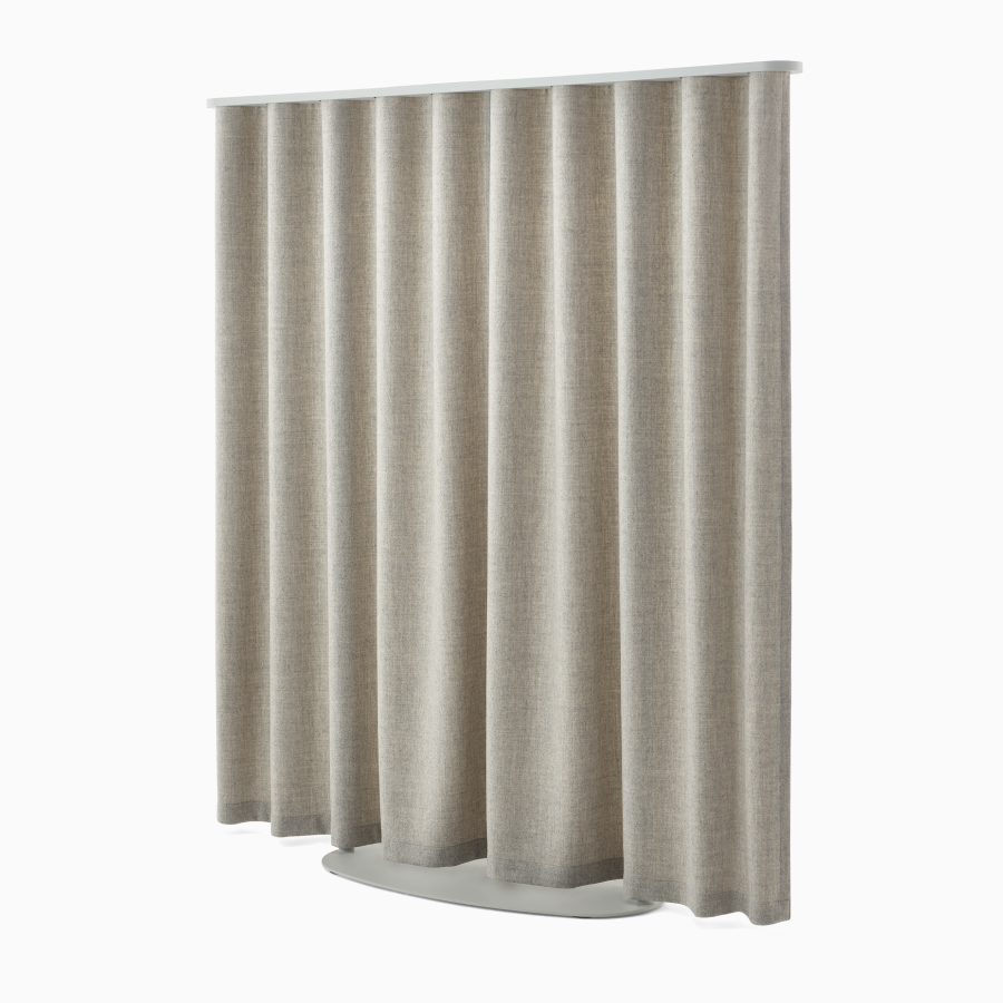 Light brown OE1 Freestanding Curtain with grey frame viewed from a front angle.