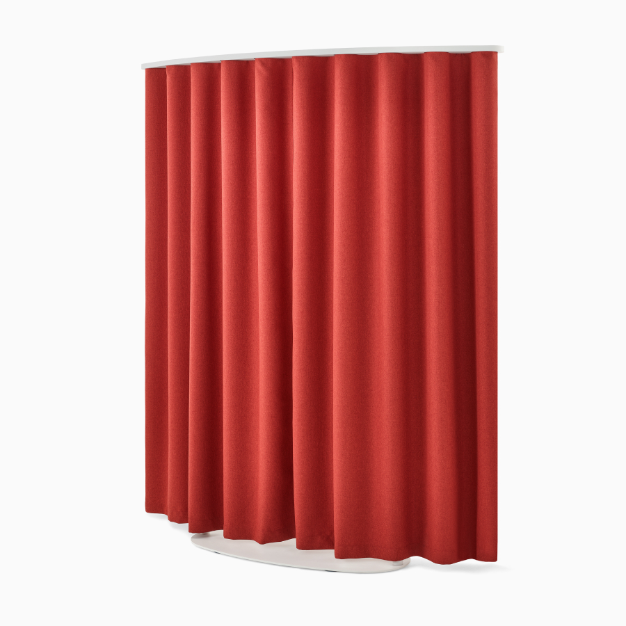 Curved, red OE1 Freestanding Curtain with white frame viewed from a front angle.