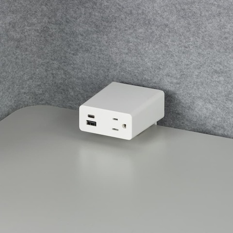 Close up image of a white Logic Mini with one simplex receptacle, one USB-C port and one USB-A port.