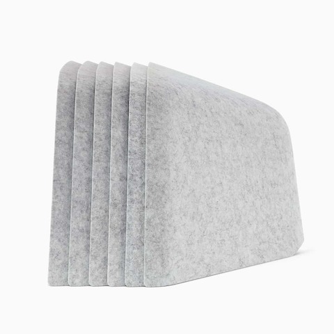 Six grey OE1 Personal Hoodies stacked together, viewed from the side.