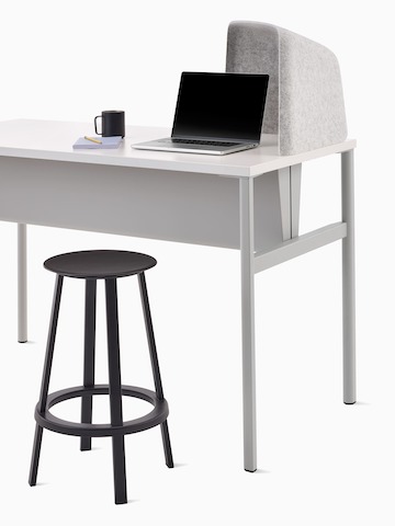 Grey OE1 Personal Hoodie on a grey and white OE1 Communal Table and a dark grey Revolver stool.