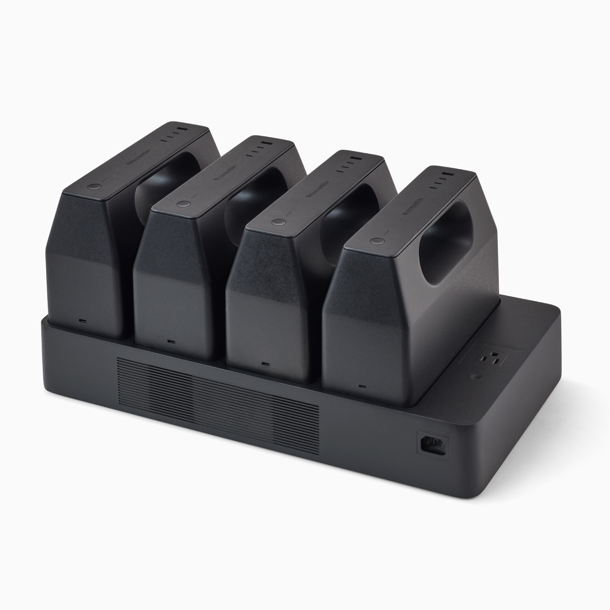 Four black OE1 Power Pack batteries mounted on a black OE1 Power Tray, viewed from an angle.