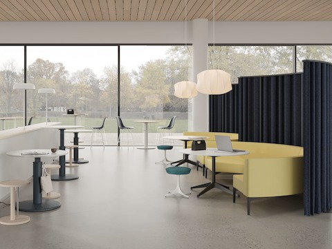 Community socialization area with OE1 Sit-to-Stand Tables, OE1 Freestanding Curtains, occasional tables and sofas.