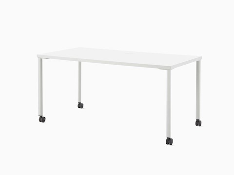 A white OE1 Rectangular Table with light grey legs and black casters, viewed from an angle.