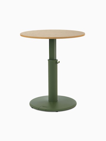 OE1 Sit-to-Stand Table with green base and brown round surface at a standing height, viewed from a front angle.