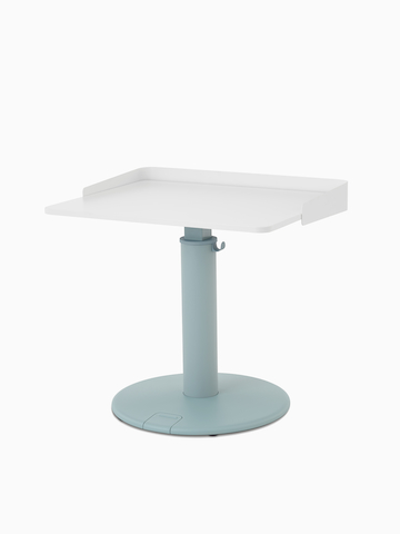 OE1 Sit-to-Stand Table with light blue base and white rectangular surface viewed from a front angle.