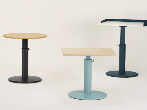 Three OE1 Sit-to-Stand Tables in various colors and surface shapes.