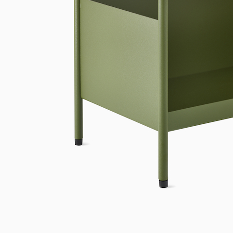 Close up image of a green individual OE1 Storage Trolley with glides, viewed from a front angle.