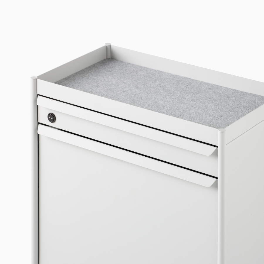 Close up image of a white individual OE1 Storage Trolley with drawer, tip-out bin and liner, viewed from a front angle.