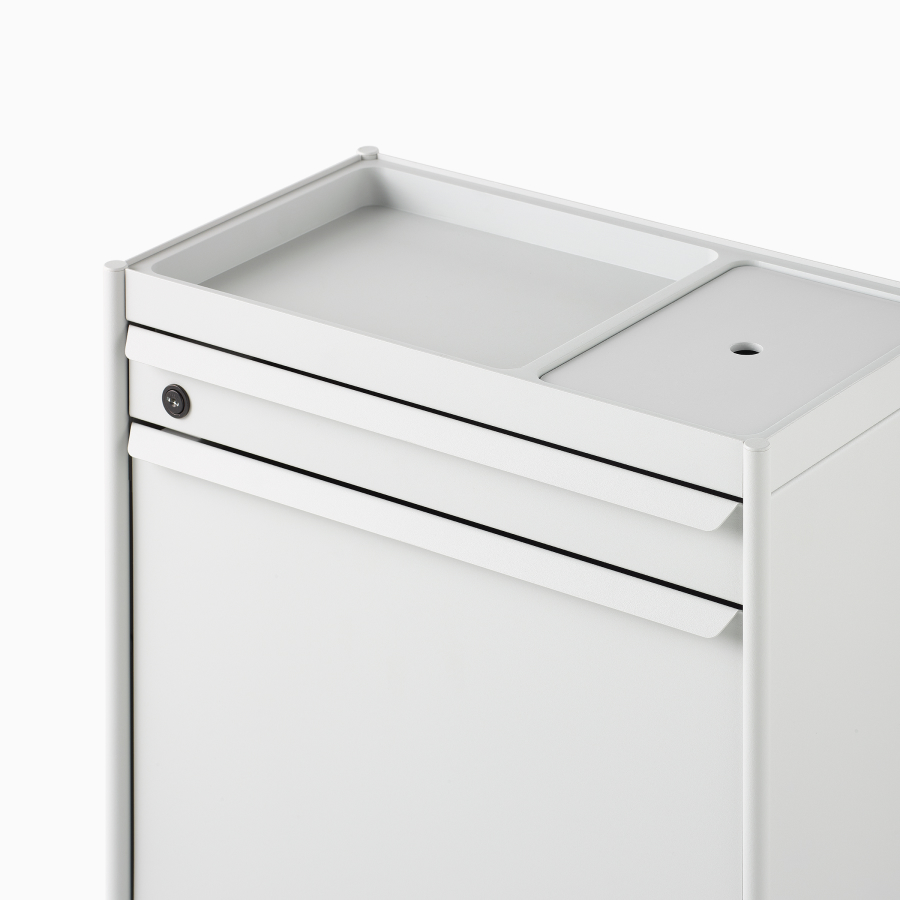 Close up image of a white individual OE1 Storage Trolley with drawer, tip-out bin and organizer, viewed from a front angle.