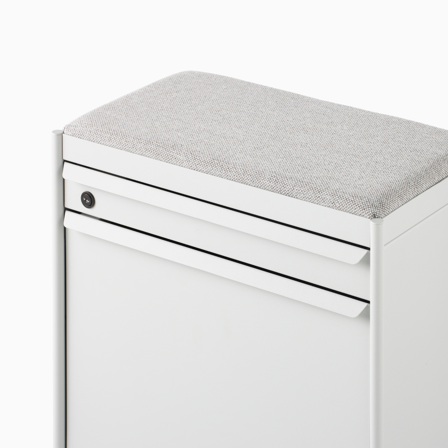 Close up image of a white individual OE1 Storage Trolley with drawer and tip-out bin, viewed from a front angle.