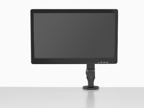 Ein Monitor, der von einem an der Oberfläche angebrachten Ollin-Monitorarm unterstützt wird.
