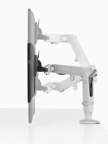 Profile view of an adjustable Ollin Monitor Arm positioning a monitor at three different heights. Profile view of an adjustable Ollin Monitor Arm positioning a monitor at three different heights.