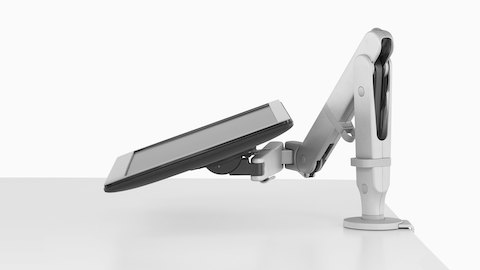 Profile view of an adjustable Ollin Monitor Arm supporting a monitor at an extremely low angle. Profile view of an adjustable Ollin Monitor Arm supporting a monitor at an extremely low angle.