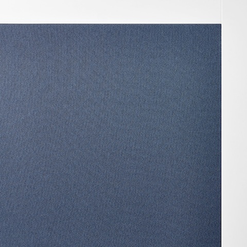 A close-up of dark blue fabric on Overlay's white structure.