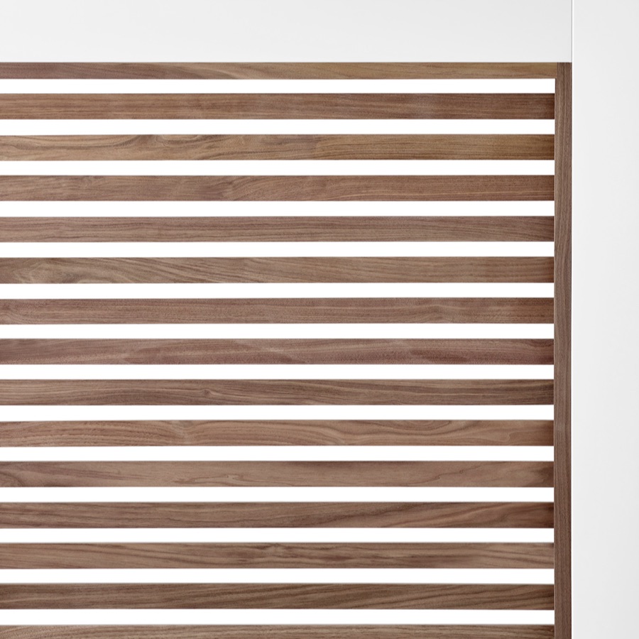 A close-up of walnut wood slats on Overlay's white structure.