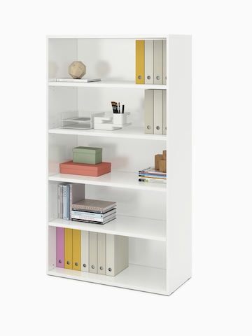 A white Paragraph Storage unit with five open modules contains books, binders, and supplies.