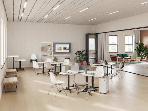 A selection of small and large Passport Work Tables are featured in a team collaboration training room setting.