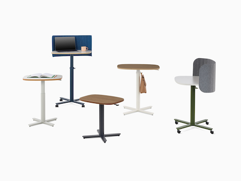 Multiple Passport Work Tables in both small and large size with a variety of base finishes, mix of solid and woodgrain tops, and accessories.