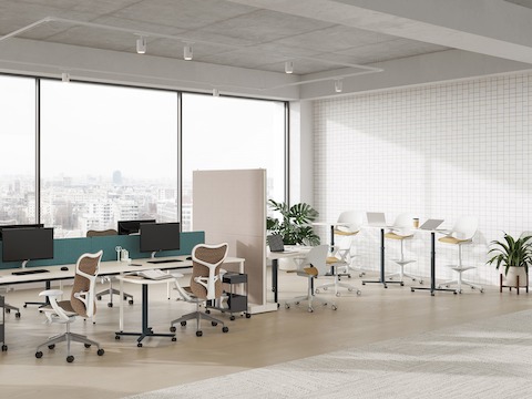 A selection of large Passport Work Tables are featured in a team collaboration setting.