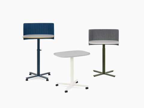 Three Passport Work Tables shown with various accessories in a variety of heights and finishes.