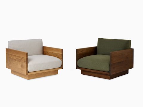 Pawson Drift Lounge Chairs in oak frame and grey cushions and a walnut frame with green cushions.