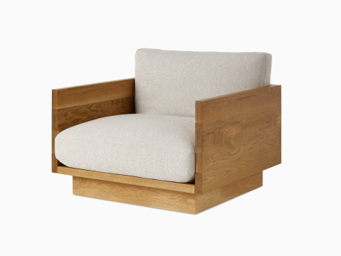 Angle view of the Pawson Drift Lounge Chair in oak frame and grey cushions