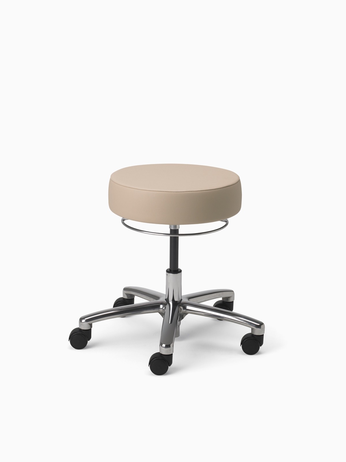 A Physician Stool in tan fabric with aluminum base and polyurethane casters.