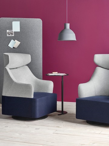 Two Plex club chairs with blue seats, grey backs and grey headrests.
