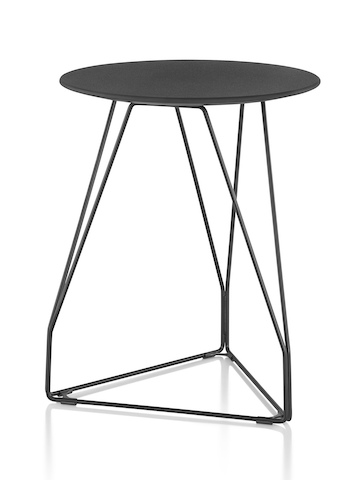 A round Polygon Wire occasional table with a black top and wire base. 