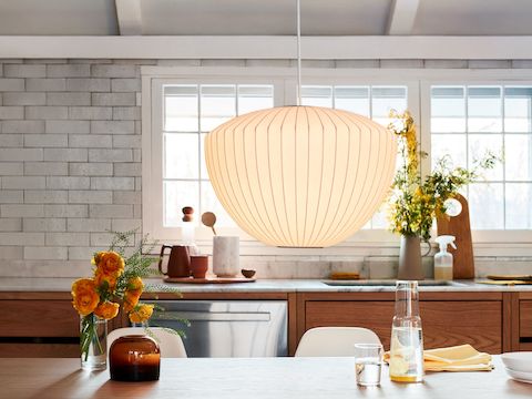 A Nelson Apple Bubble Pendant displayed in a kitchen setting.