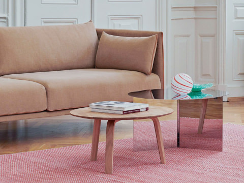 A living room featuring a HAY Dapper Lounge Chair, Silhouette Sofa, Slit Table, and Bella Coffee Table.