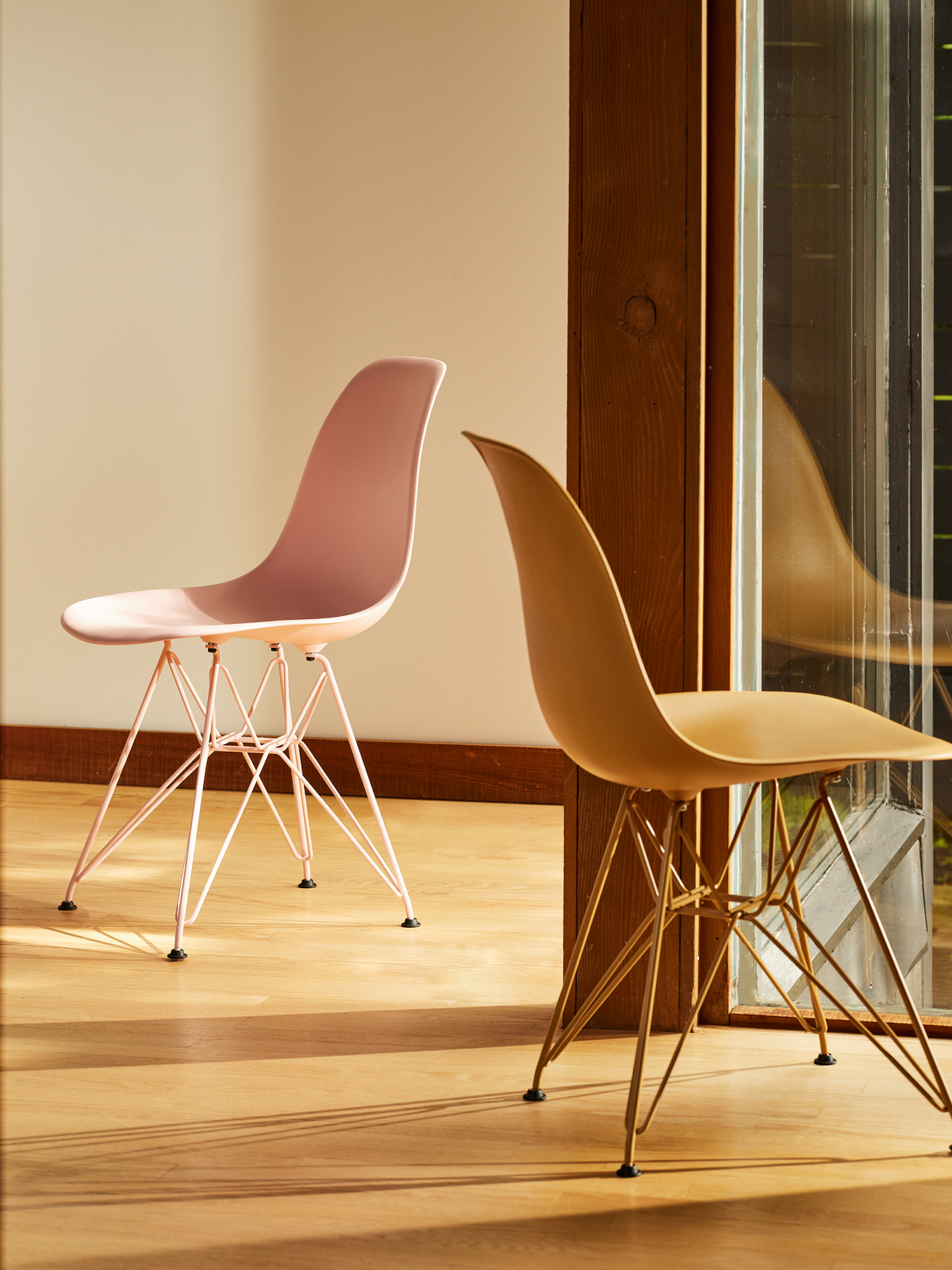 Herman Miller x HAY Eames Moulded Plastic Chairs in pink and toffee.