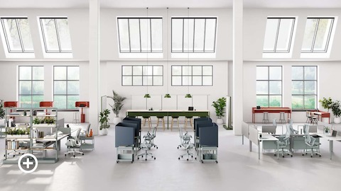 Open floor workspace with various OE1 Workspace Collection products in red, green and blue.