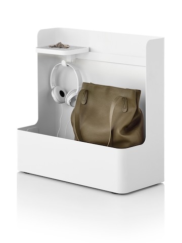 A purse and headset stored in an Ubi Mobile Bag Catch. Select to go to the desk accessories page for the Thrive Ergonomic Portfolio.