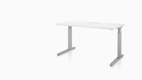 A rectangular Renew Sit-to-Stand Table with a white top and gray legs, viewed from a 45-degree angle. A rectangular Renew Sit-to-Stand Table with a white top and gray legs, viewed from a 45-degree angle.