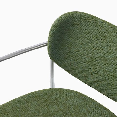 Detail image of Portrait Chair with upholstered seat and back, satin chrome frame with arms.
