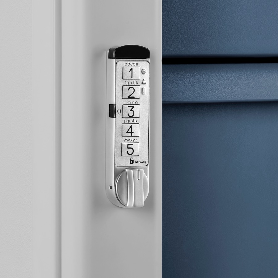 Close-up of a RFID keyless lock on a supply cart with a light gray body and midnight blue drawers.