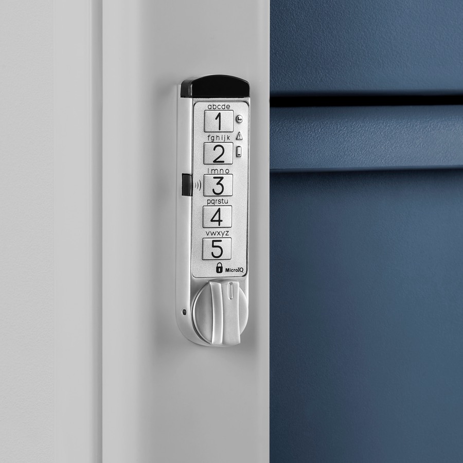 Close-up of a RFID keyless lock on a supply cart with a light gray body and midnight blue drawers.