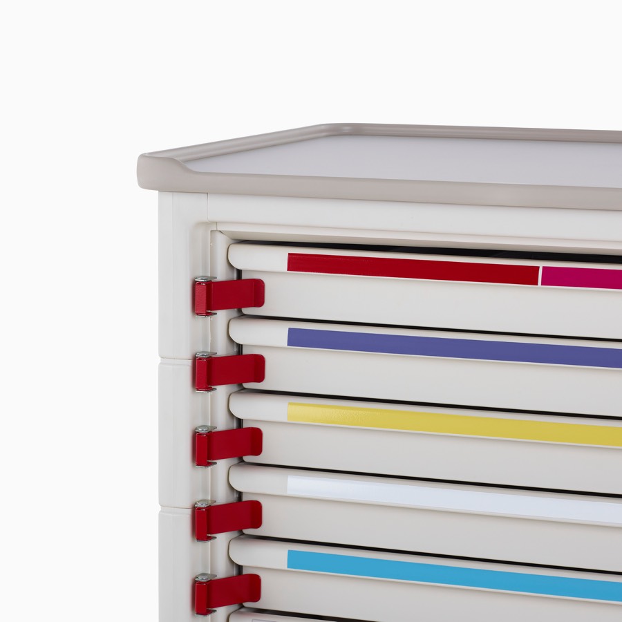 Detail of Procedure and Supply Cart in a soft white body and modular drawers with breakaway tabs and color-coded drawers for emergency departments.