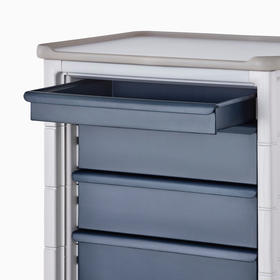 Detail of Procedure and Supply Cart in a light gray body and dark blue three-inch modular drawer.